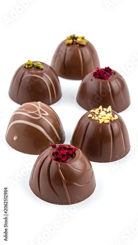Delicious chocolate truffles with toppings.