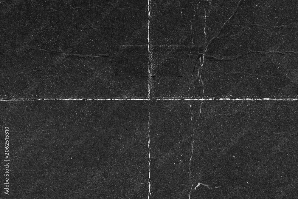 Fototapeta premium Vintage paper surface displaying rough grain, distressed imperfections, and dark texture effects.