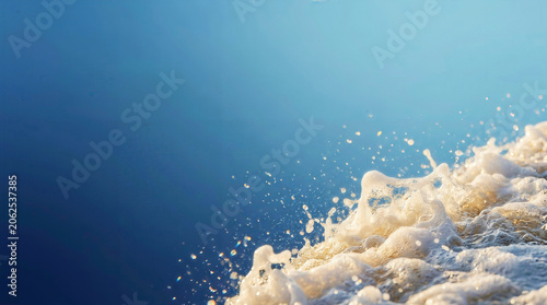 Macro Ocean Wave Foam Frozen in Golden Hour Sunlight with Massive Navy-Blue Copyspace