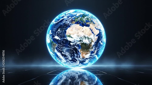 Rotating holographic earth globe on dark reflective surface with blue glow.