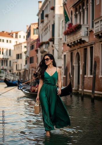 Woman in Green Dress Walking in Venetian Canal.