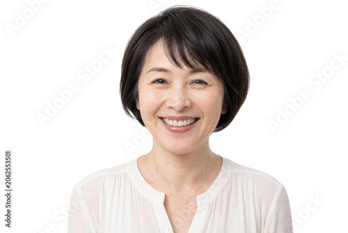 Portrait of a Happy Middle-Aged Japanese Woman Smiling on White Background
