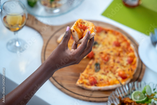 Pizza restaurant cafe model food lifestyle showcasing gourmet pizza dining modern cafe atmosphere and relaxed hospitality experience in Tanzania