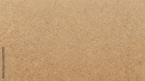 Natural light brown fiber board background.