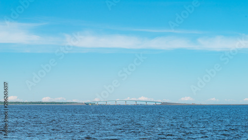 Minimalist landscape with a bridge in the sea. Copy space. Bridge connection between Hailuoto Island and mainland Finland.