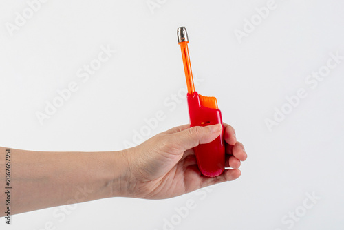 Canvastavla Red gas lighter gun for gas-stove and hand isolated on white background