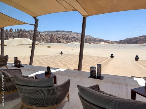 Luxury desert camp terrace with sandstone cliffs in AlUla, Saudi Arabia