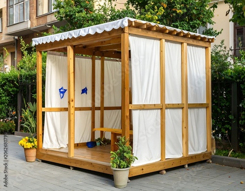 Wooden outdoor gazebo with white curtains