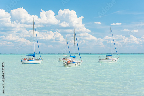 Hungary, Lake Balaton, sailboat moored on the water, view of the other side of the lake on a sunny summer day.