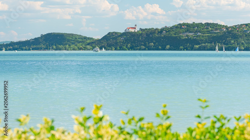 Hungary, Lake Balaton, Benedictine monastery on a hill in Tihany, view from the other shore of Lake Balaton on a sunny summer day.
