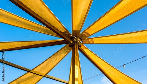 Wooden pergola roof against clear sky