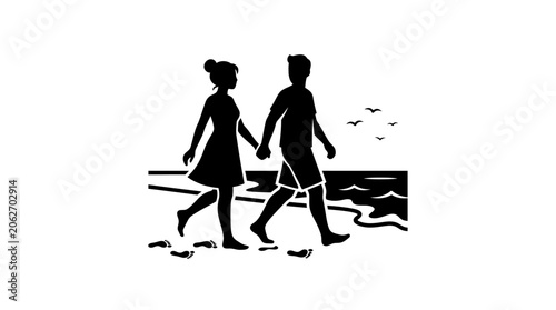 Couple holding hands walking on beach silhouette.