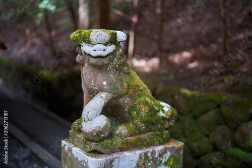 Moss covered guardian statue in Hakone
