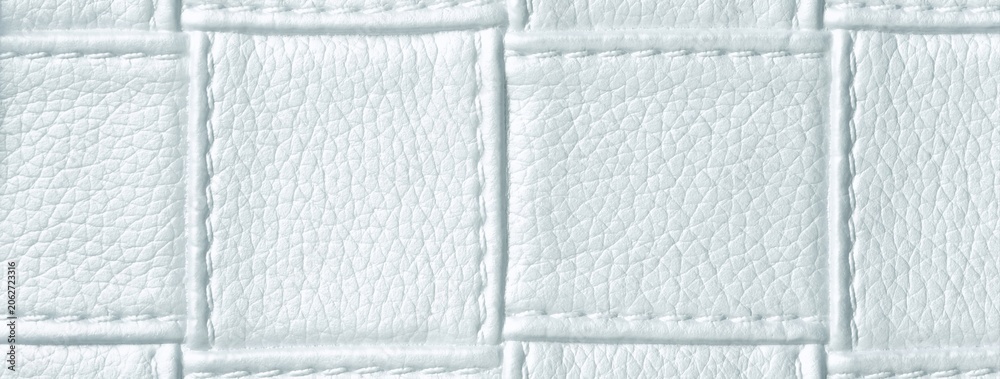 Naklejka premium Texture cool white leather background with quilted stitched pattern, macro. Abstract ivory upholstery surface