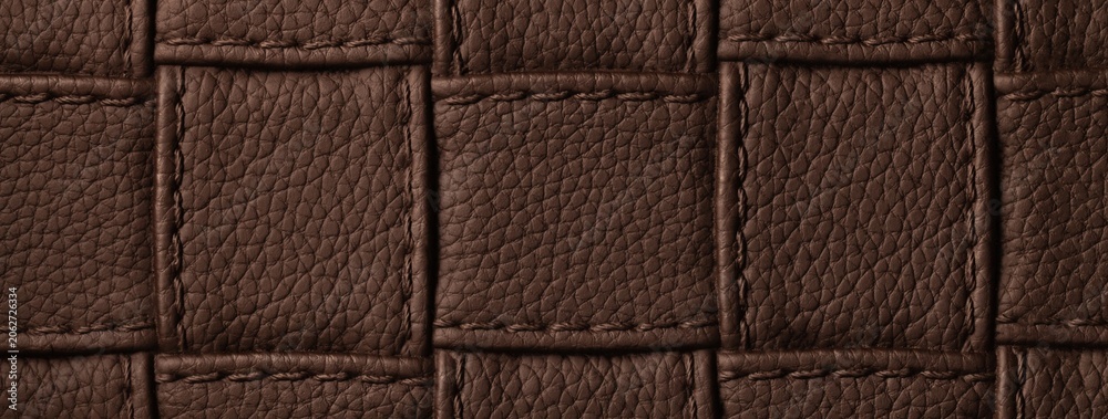 Naklejka premium Texture dark brown leather background with quilted stitched pattern, macro. Abstract chocolate upholstery surface