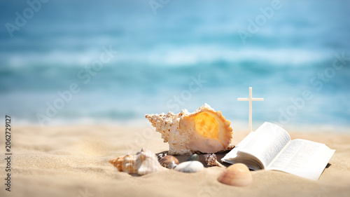 Bild auf Leinwand Summer camp background featuring the Cross of Jesus Christ, a Bible, and a seash
