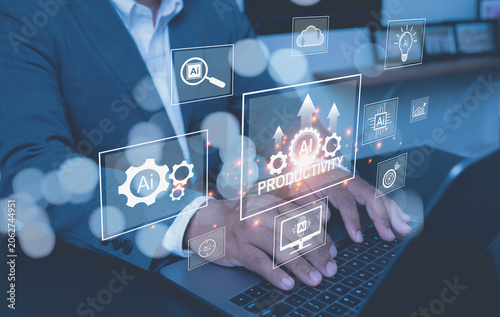 A businessman types on a laptop, a central floating digital screen displays upward arrows, gears, and the word PRODUCTIVITY.