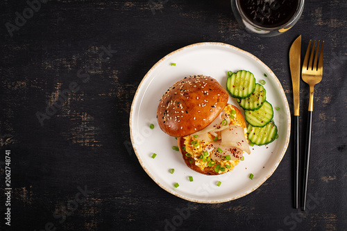 Savory Breakfast Burger with Scrambled Eggs and Escolar. Top view