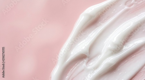 Extreme macro close-up of luxurious cosmetic cream texture with pastel pink copy space