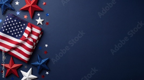 Patriotic American flag with decorative red white and blue stars over a dark navy background flat lay composition for 4th of July celebration card