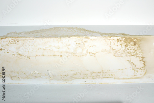 damaged ceiling with severe water stains, mold, and cracks caused by rain leaking through the roof. The image shows moisture damage and fungus growth from a ceiling leak problem water leaking ceiling