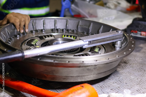 Obraz na plátně Tightening Bolts on Torque Converter Clutch Damper Using Torque Wrench