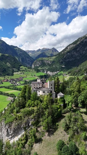 Cinematic Drone Footage of Austrian Castle and Alpine Mountains – Historic Landmark and Scenic Landscape