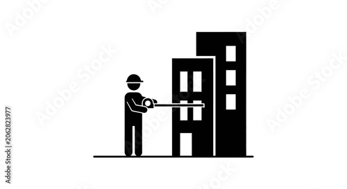 Foto Man holding a sledgehammer standing outside.