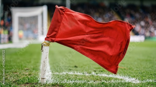 Red flag on soccer field corner.