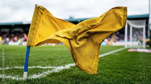 Yellow flag on soccer field corner.