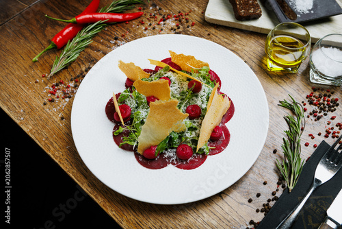 Healthy beet appetizer with crispy bread and microgreens