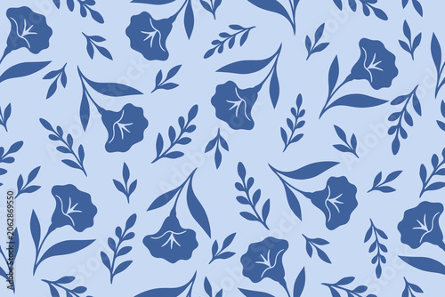 Elegant seamless floral pattern featuring delicate blue bell-shaped flowers and leafy branches on a soft pastel blue background, perfect for fabric and wallpaper.