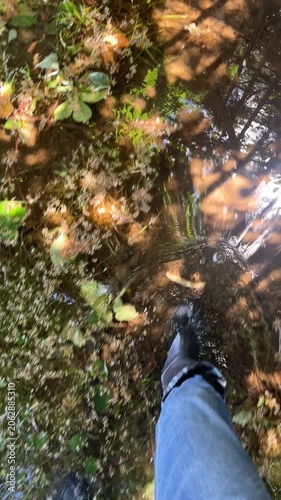 Video with the sound of squelching mud and flooded soil. Wellingtons is waterproof shoes for exploring forests and flooded area. Slop
