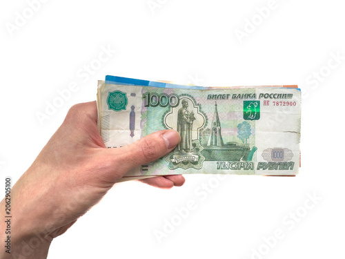 Εκτύπωση καμβά Hand holding Russian roubles banknotes with visible denomination and design deta