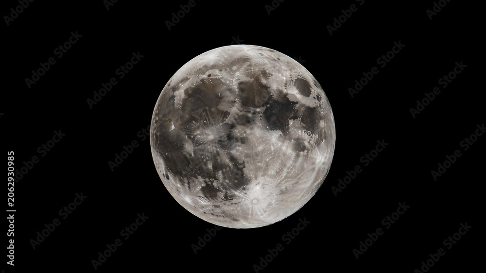 Fototapeta premium Full moon against a black background, lunar surface details craters gray