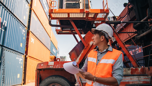 Worker male engineer safety helmet vest clipboard shipping container logistics professional worker male engineer safety helmet vest clipboard shipping container logistics terminal outdoor