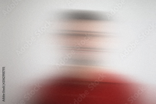 Blurry portrait of person wearing red shirt background white motion blur effect abstract textured grainy.
