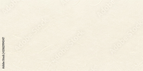 Handmade cream and ivory textured paper background with natural fiber grain and a soft speckled matte surface for eco packaging and minimal craft design mockups