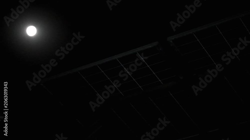 Modern solar panels installation under a clear night sky with bright moonlight 180fps Captured in Cinematic High Detail Footage