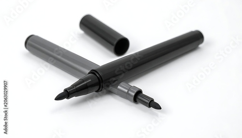 Isolated black felt tip pens with removed caps for drawing, office stationery, sketching supplies, writing instruments