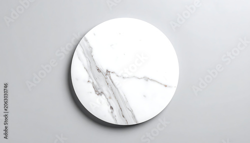 Isolated circular piece of white marble with grey veins and natural stone texture