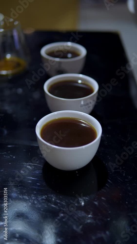 Professional barista preparing coffee cupping tasting event