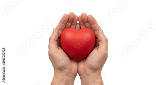 Фотография Caring hands holding a red heart symbol for love and compassion