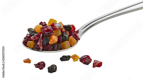 Photos Mixed dried fruit medley on spoon cranberries raisins, apricots