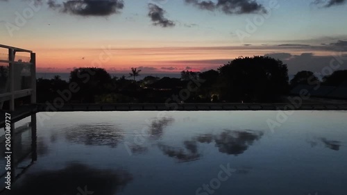 sunset at a rooftop pool in kuta on bali