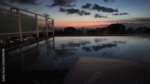 sunset at a rooftop pool in kuta on bali