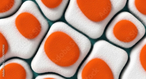 Closeup of white and orange pills or tablets on green surface