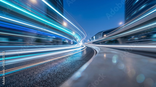 Long exposure light trails on modern city highway at night