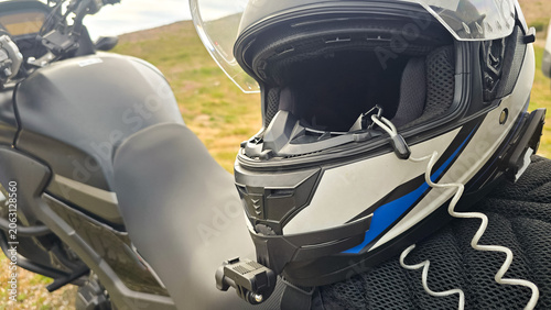 A motorcycle parked on a ledge at the top of a mountain in northern Portugal. Motorcycle travel ideas, practical problem-solving, and mobility for adventure.
