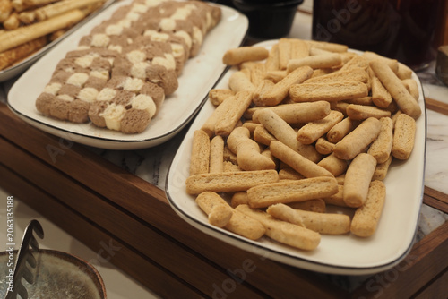 Quadro su tela Baked goods on display at a food gathering event
